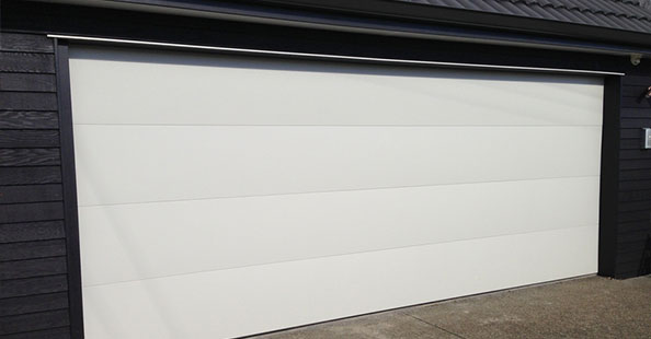 Puertas seccionales con panel liso